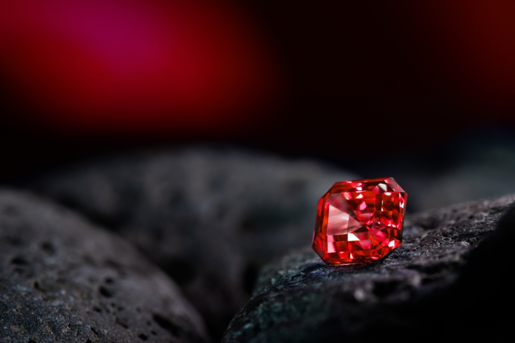 Red,Sapphire,Gemstone,On,Black,Natural,Stone