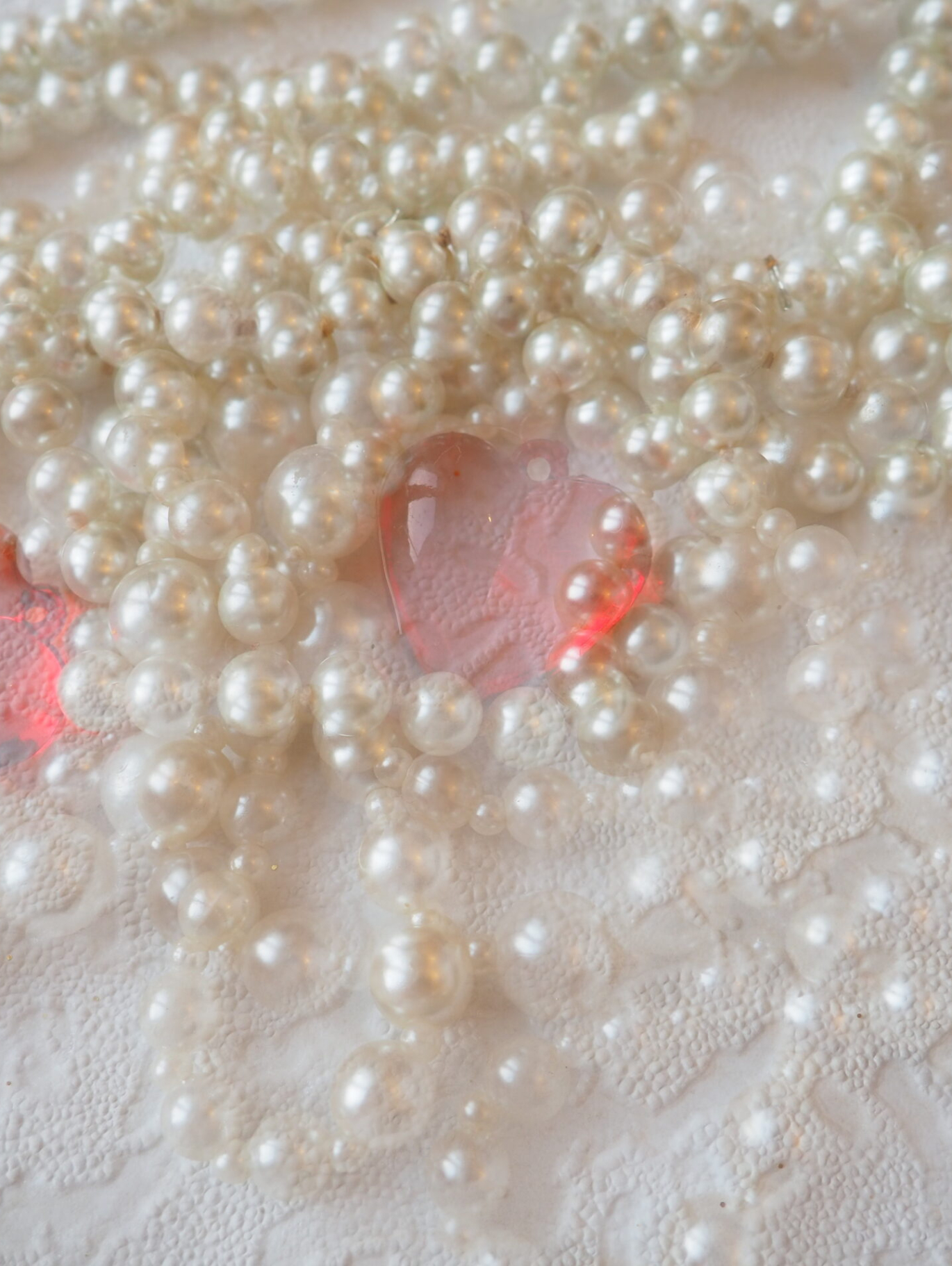 White beads. Decorative decoration. Women's jewelry. Beautiful shiny bright beads. Fashion background. Collage and double exposure
